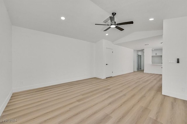 unfurnished living room with ceiling fan, light wood-type flooring, and lofted ceiling