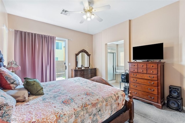 bedroom with ceiling fan, carpet floors, and ensuite bathroom