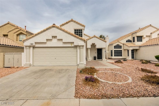 mediterranean / spanish-style house featuring a garage