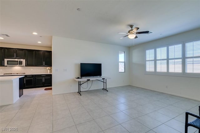 tiled living room featuring ceiling fan