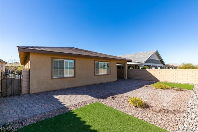 back of house featuring a patio area