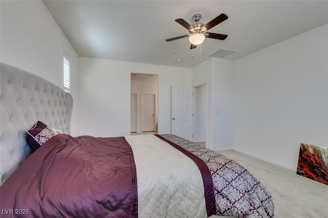 bedroom featuring light colored carpet and ceiling fan