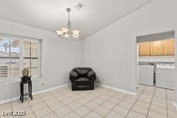 unfurnished room featuring a notable chandelier and light tile patterned flooring