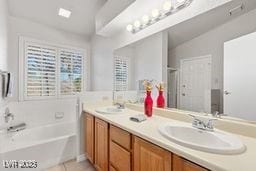 bathroom featuring tile patterned floors, separate shower and tub, vanity, and lofted ceiling