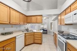 kitchen with light tile patterned flooring and white appliances