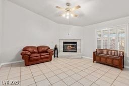 living room featuring ceiling fan and light tile patterned flooring