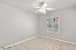 empty room featuring ceiling fan and light tile patterned flooring