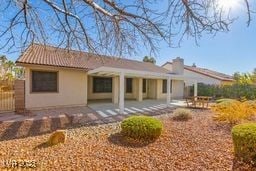 back of house with a patio