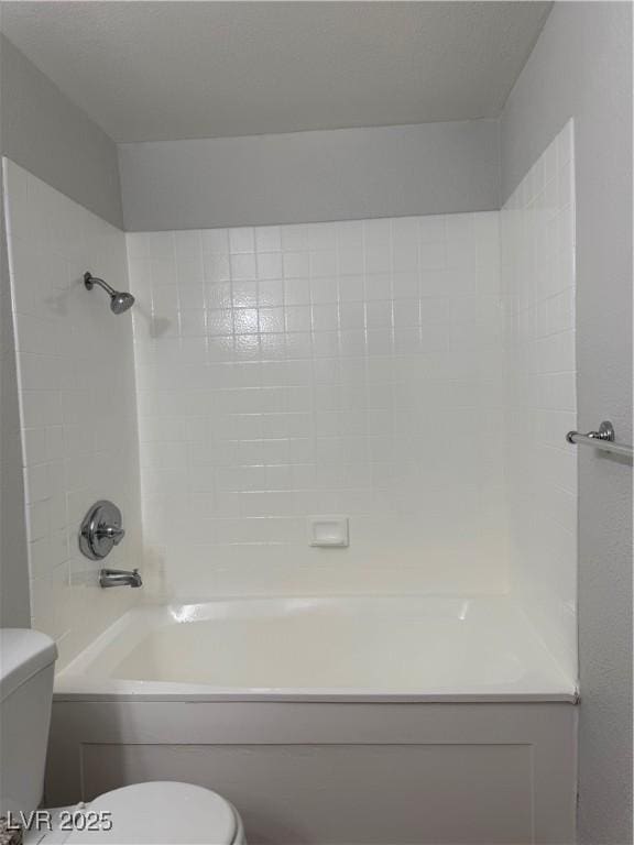 bathroom with toilet and shower / bath combination