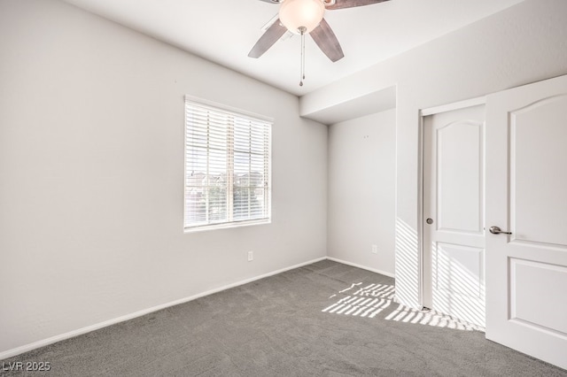 unfurnished bedroom featuring carpet flooring, ceiling fan, and a closet