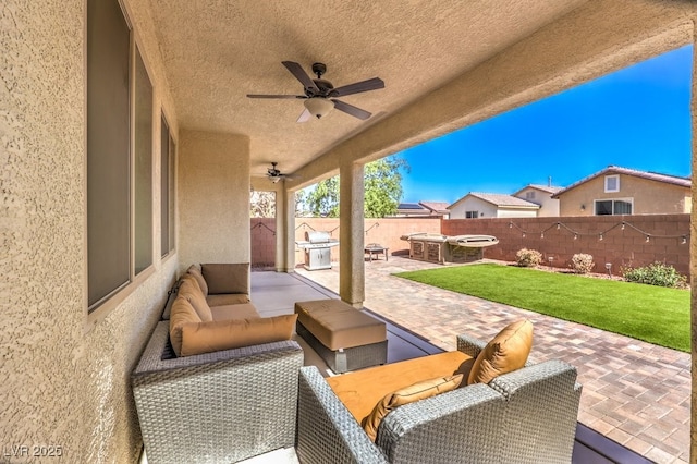 view of patio featuring an outdoor hangout area and ceiling fan