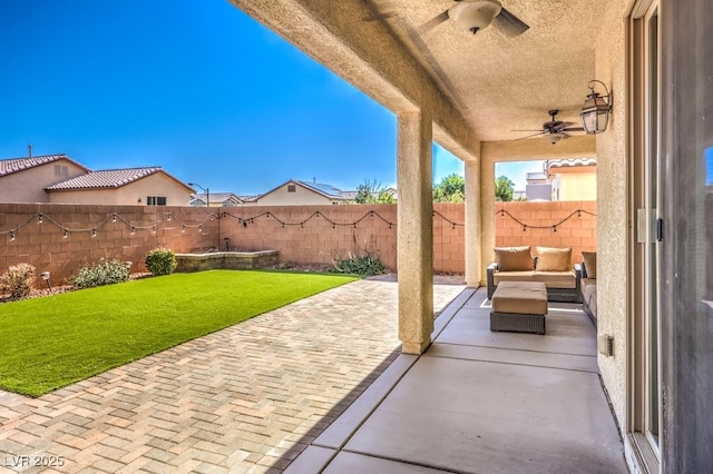 view of patio / terrace featuring ceiling fan and an outdoor hangout area