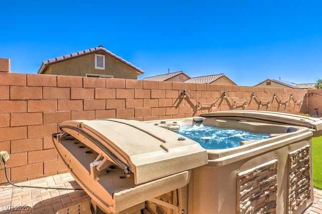 view of patio with a hot tub