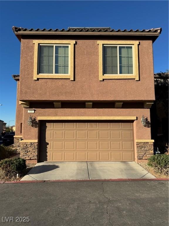 view of front of home with a garage