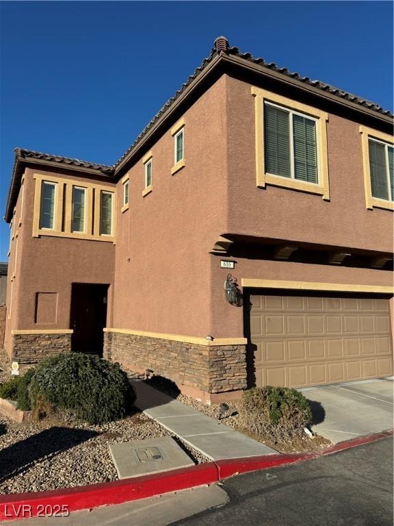 view of side of property with a garage