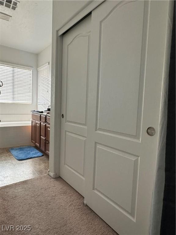 interior space featuring light colored carpet