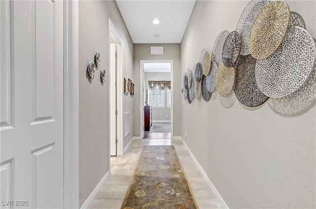 hallway featuring light tile patterned floors