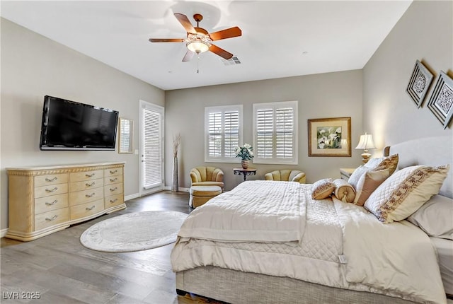 bedroom featuring ceiling fan and hardwood / wood-style flooring