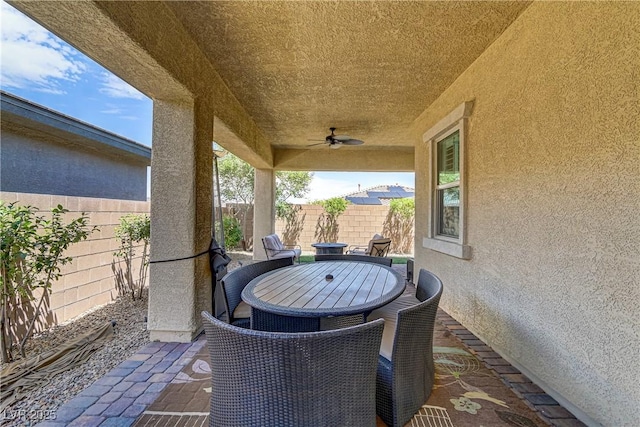 view of patio / terrace featuring ceiling fan