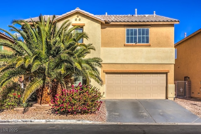 mediterranean / spanish-style house featuring a garage