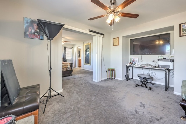 interior space with ceiling fan