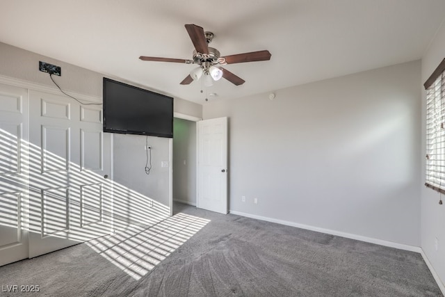 interior space with ceiling fan