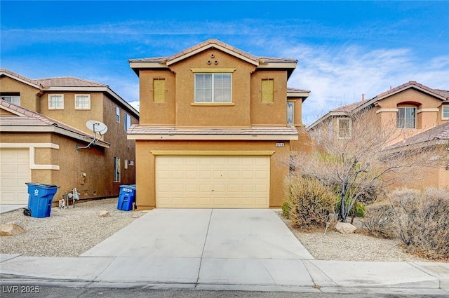 traditional-style home featuring a tiled roof, stucco siding, driveway, and a garage