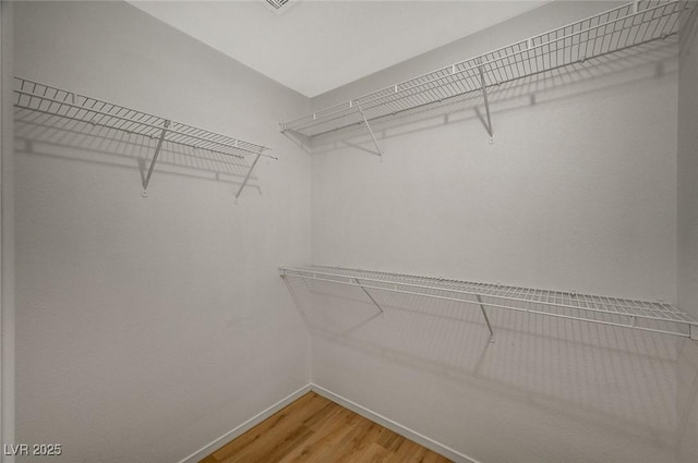 walk in closet featuring light wood-type flooring