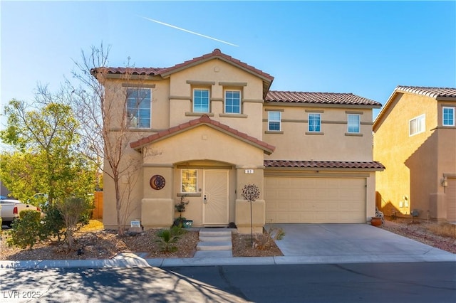 mediterranean / spanish-style home with a garage