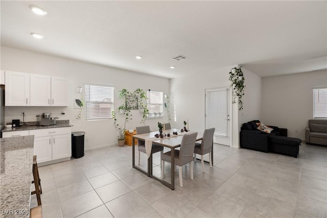 dining room featuring light tile patterned floors