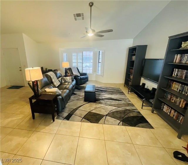 tiled living room with ceiling fan