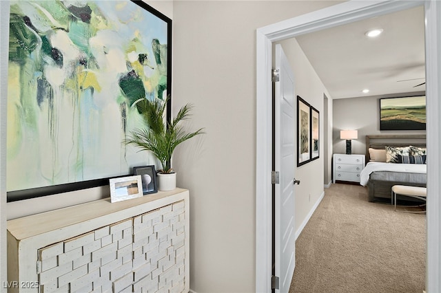 hallway featuring light carpet