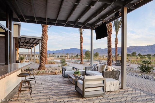 view of patio featuring an outdoor living space and an outdoor bar