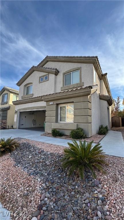 front of property with a garage