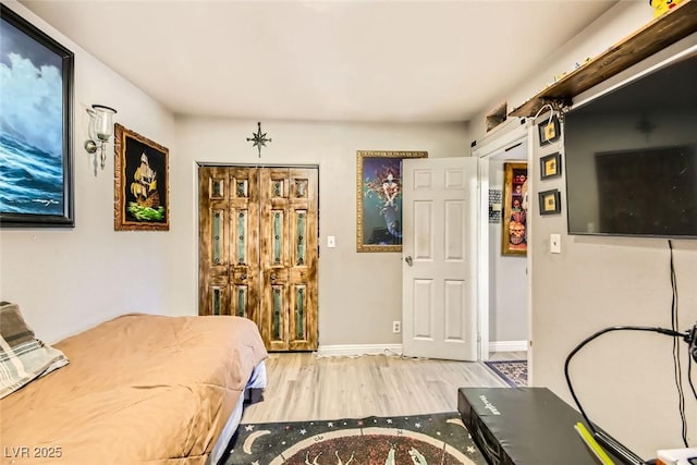 bedroom with light hardwood / wood-style floors