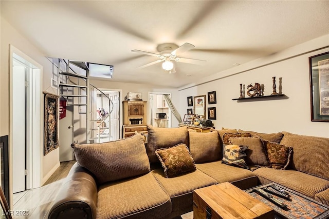 living room with ceiling fan and hardwood / wood-style floors