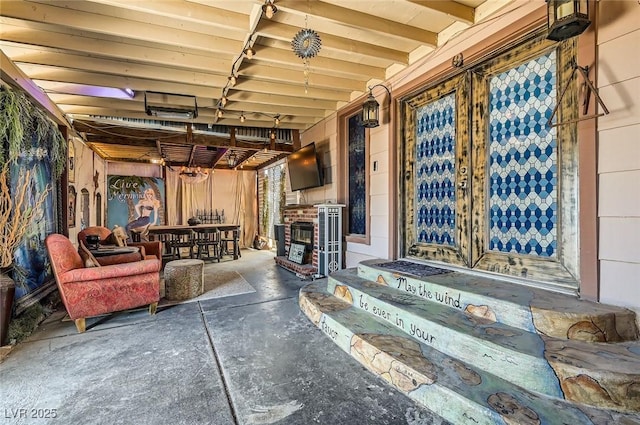 919 Havre Ave, Henderson, NV 89015 - interior space featuring unfinished concrete flooring and a brick fireplace