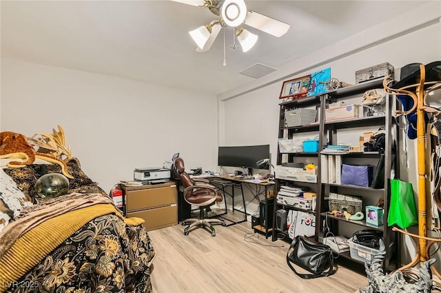 919 Havre Ave, Henderson, NV 89015 - bedroom with an office area, wood finished floors, and ceiling fan