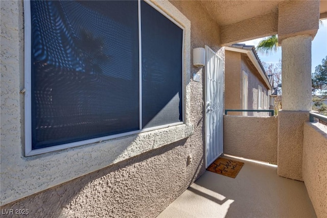 entrance to property with a balcony