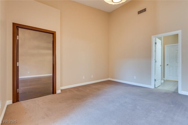 unfurnished room featuring carpet