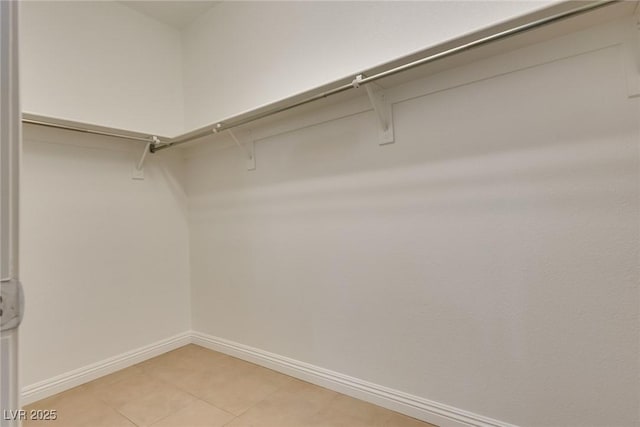 spacious closet featuring tile patterned floors