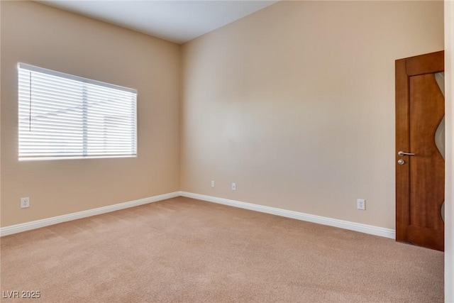 spare room with light colored carpet