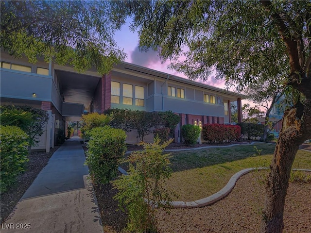 view of front of property with a yard