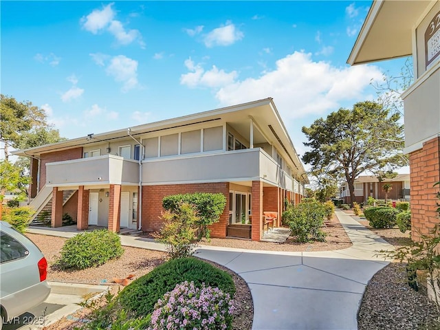 view of front of property with a balcony