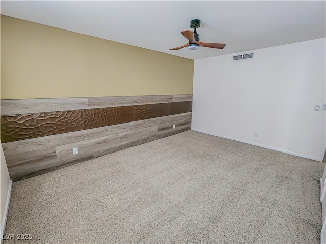 spare room with carpet flooring and ceiling fan