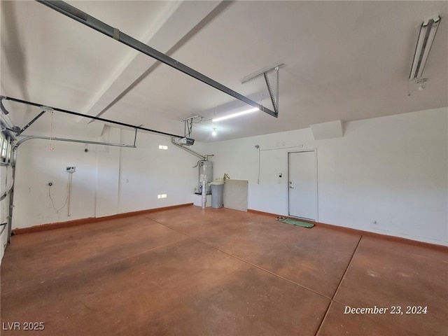 garage featuring a garage door opener and water heater