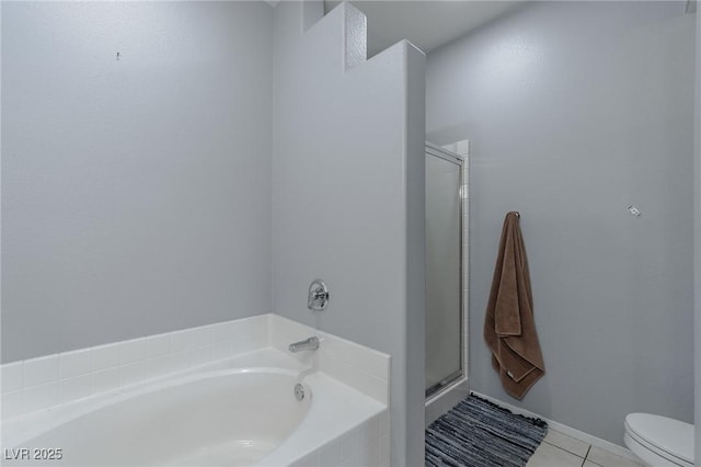 bathroom with tile patterned floors, shower with separate bathtub, and toilet