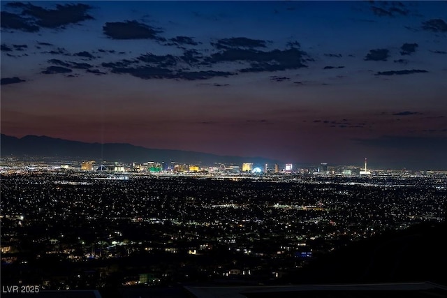 property's view of city featuring a mountain view