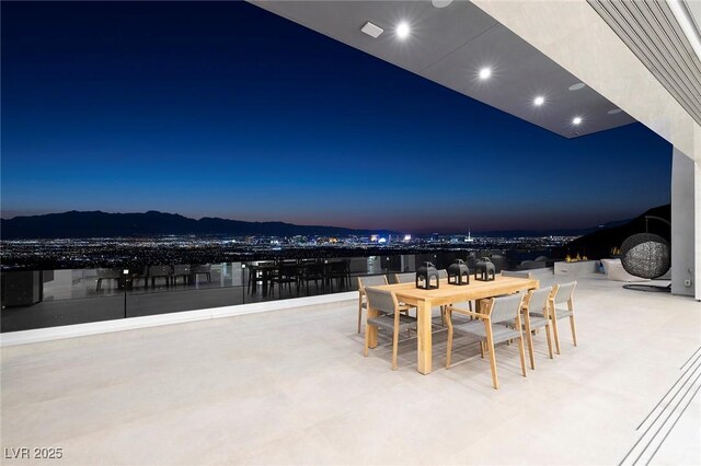 patio terrace at dusk with a mountain view