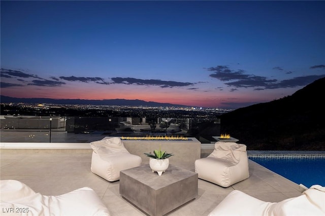 patio terrace at dusk with a mountain view